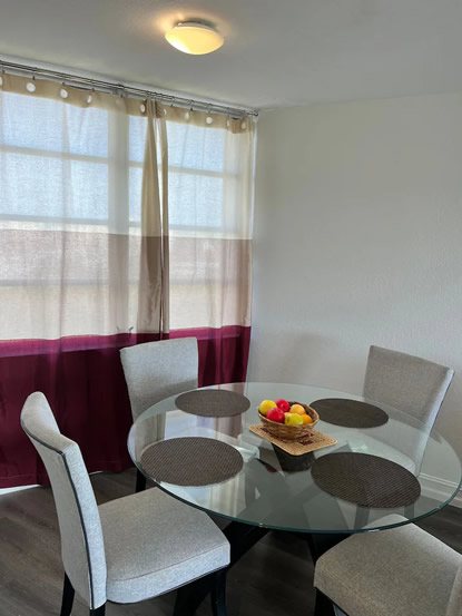 Dining table beside a bright window