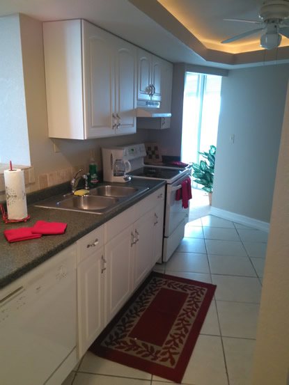 Full kitchen with white cabinetry
